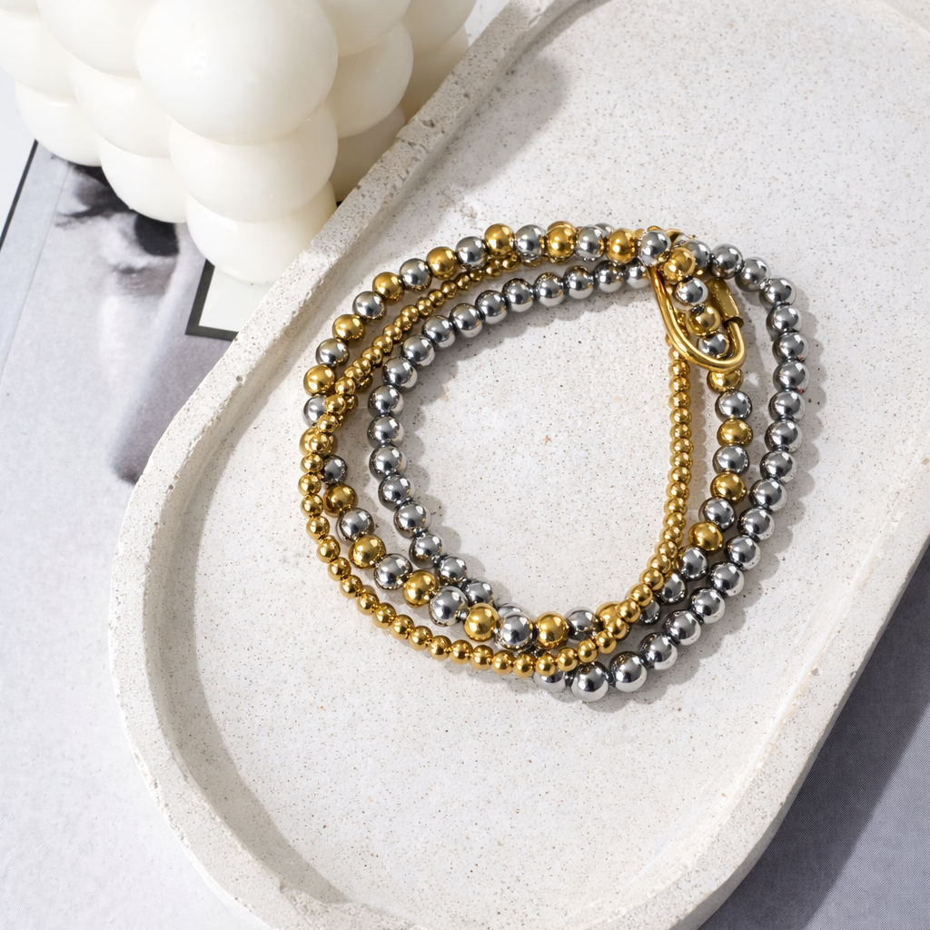 Tres pulseras bicolor