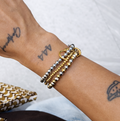 Tres pulseras bicolor
